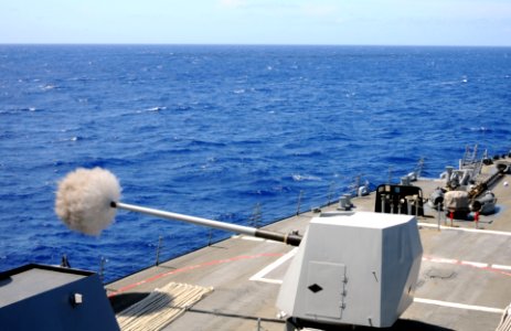 A 5-inch gun fires aboard USS Winston S. Churchill. (8594719701)