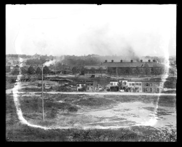 A 4 part panorama from Randall School, Half and South Capitol Street between H & I Streets, S.W., showing an overview of abandoned buildings, railroad, and other buildings LCCN2016647090