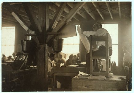 A 'Reader' in cigar factory, Tampa, Fla. He reads books and newspapers at top of his voice all day long. This is all the education many of these workers receive. He is paid by them and they LOC cph.3b36568 photo