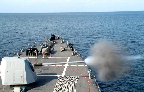 A 5-inch gun fires aboard USS Winston S. Churchill. (8224207714)
