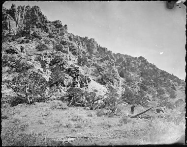 A bluff of quartzite, near the mouth of Red Creek, in Brown's Hole. Daggett County, Utah. - NARA - 516942