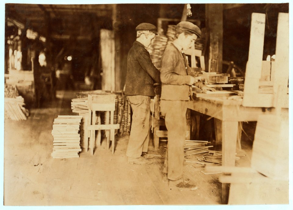 A Basket Factory. Boys making grate bottoms. In summer, many more young boys and girls. LOC nclc.04485