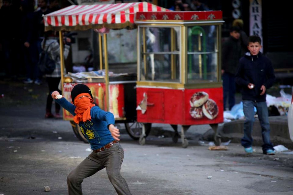A boy while throwing stone