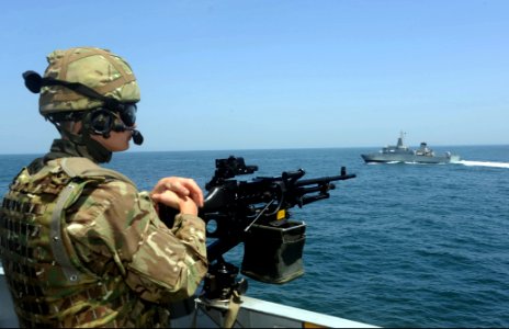 A British sailor mans a machine gun aboard Royal Navy frigate HMS Argyll (F231) while conducting training with the Royal Moroccan Navy offshore patrol vessel Bir Anzaran (P-341) during exercise Saharan Express 130312-N-IY142-291