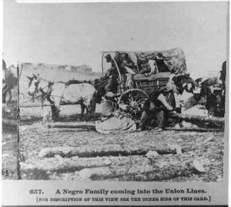 A black family entering Union lines with a loaded cart - NARA - 559271