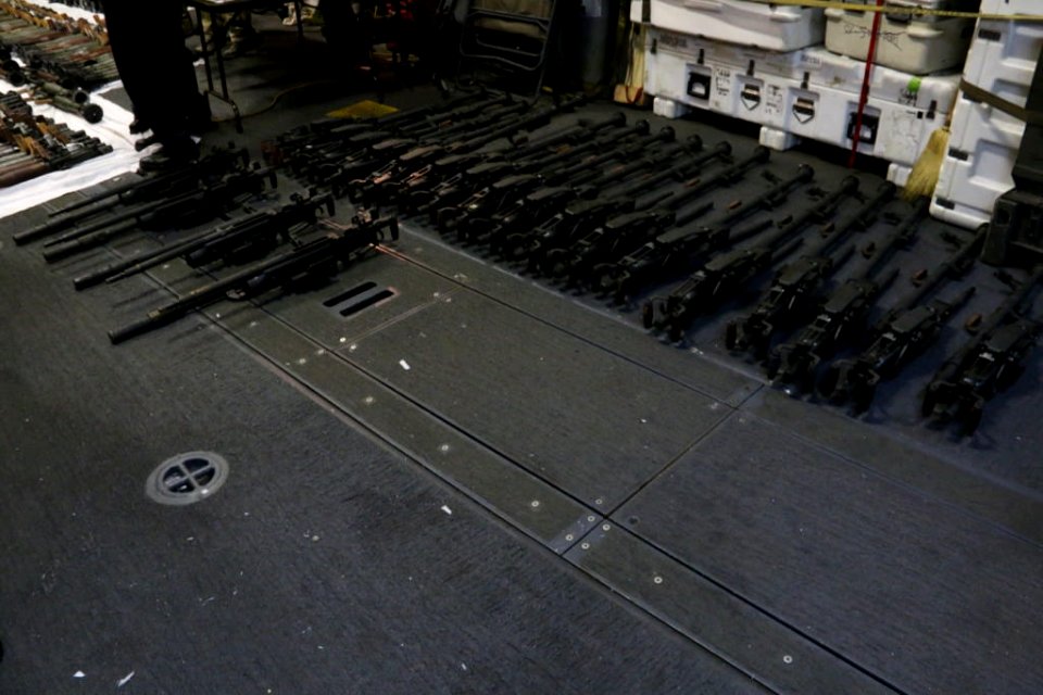 A cache of weapons is assembled on the deck of the USS Gravely. (26168183511)