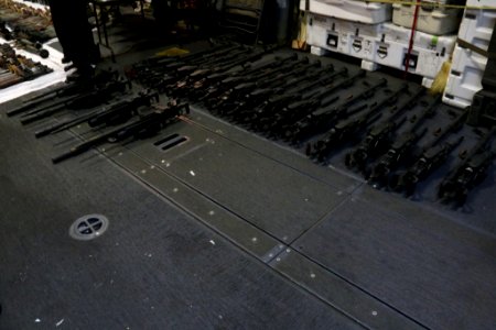 A cache of weapons is assembled on the deck of the USS Gravely. (26168183511)