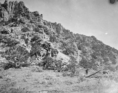 A bluff of quartzite, near the mouth of Red Creek, in Brown's Hole. Daggett County, Utah. - NARA - 516942 (cropped)