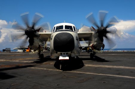 A C-2A Greyhound assigned to the Rawhides of Fleet Logistics Support Squadron 40 taxis the flight deck of the USS Theodore Roosevelt