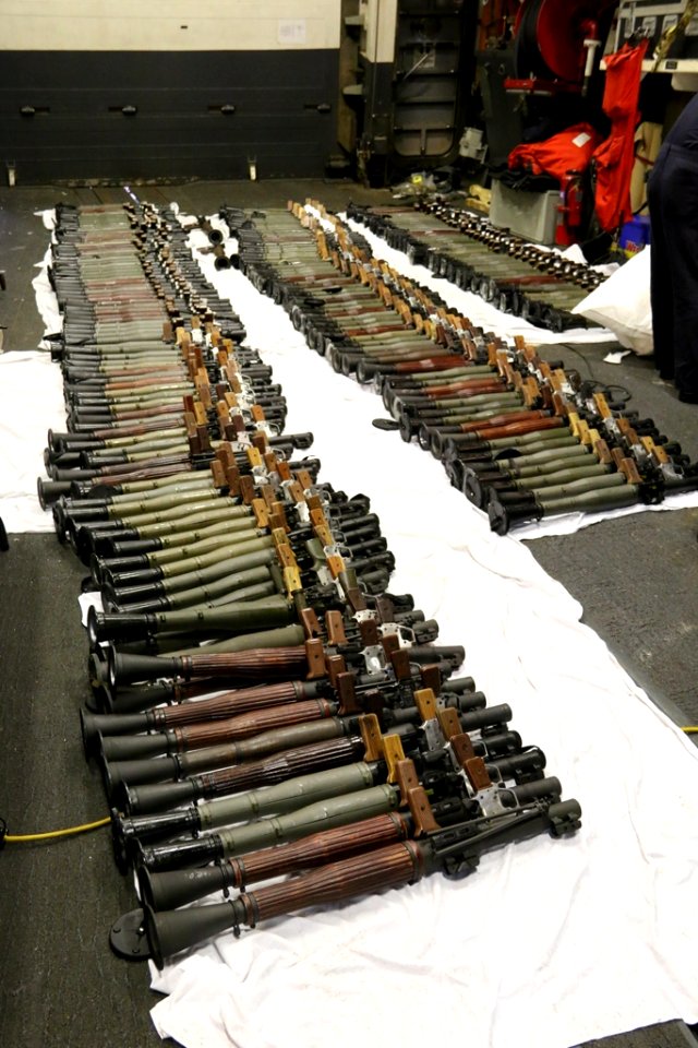 A cache of weapons is assembled on the deck of USS Gravely. (26142029092)