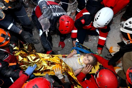 A child taken alive from a building destroyed by earthquake photo