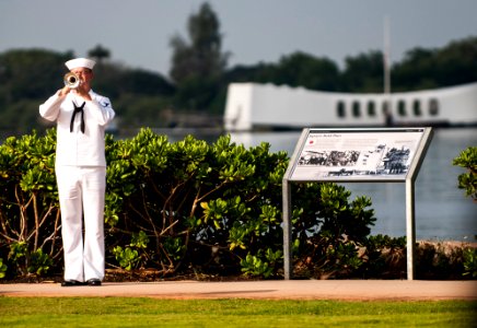 A bugler plays at Pearl Harbor Day. (8263440531)