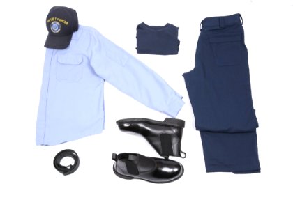 A display of the light blue over dark blue two-piece flame-resistant organizational clothing variant prototype intended for E6 and below sailors along with the molder boot, rigger’s belt, dark blue undershirt and ball cap