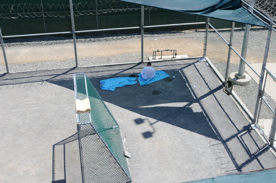 A detainee relaxes in the outdoor recreation area of Camp Six at Joint Task Force Guantanamo DVIDS380259