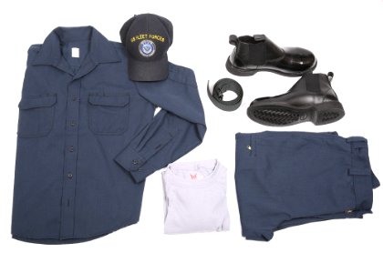 A display of the dark blue over dark blue two-piece flame-resistant organizational clothing variant prototype intended for E6 and below sailors along with the molder boot, rigger’s belt, undershirt and ball cap as compone