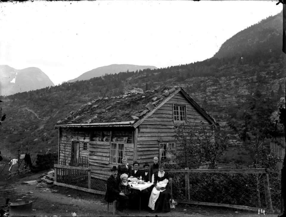 A family outside their home.