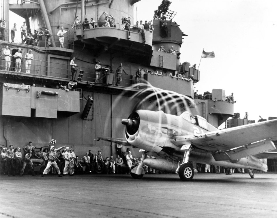 A F6F-3 Hellcat from VF-5 makes condensation rings aboard USS Yorktown (CV-10), 20 November 1943 (80-G-204747-A)