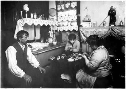 A family making silk flowers. Father wears a cast. Does not work. Boy, 11 years old, helps some. New York City. - NARA - 523516 photo