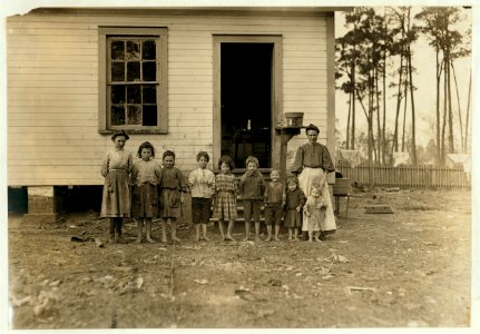 A family working in the Tifton (Ga.) Cotton Mill. Mrs. A.J. young works in mill and at home. Nell (oldest girl) alternates in mill with mother. Mammy (next girl) runs 2 sides. Mary (next) LOC cph.3a29768