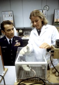 A female Air Force cadet checks on a laboratory animal. DF-ST-83-00088