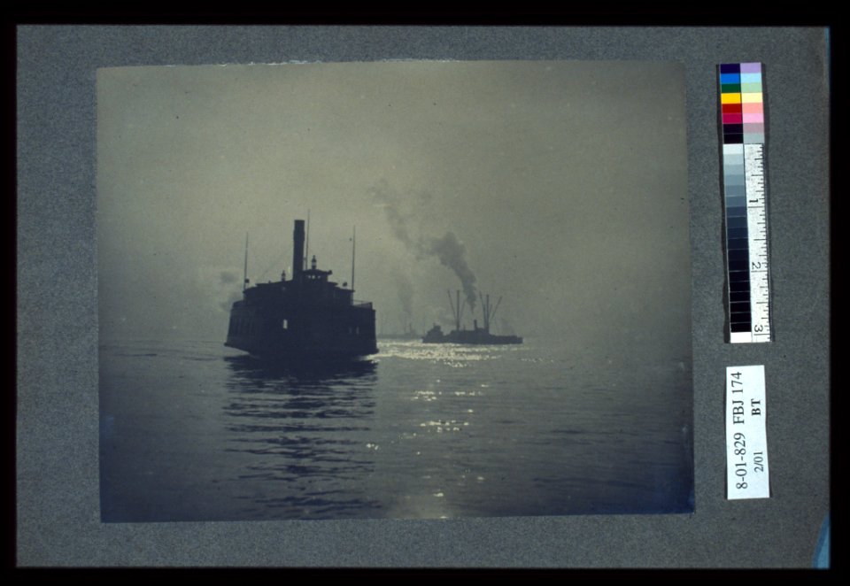 A ferry crossing a smooth body of water with other ships in the background LCCN2004676315