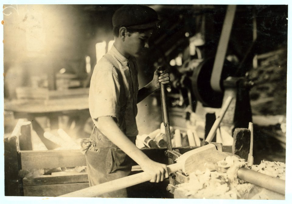 A fifteen year old boy operating a dangerous boring machine at which he said a boy recently bored half his hand off. To operate this machine (which bores a large hole in the spade handle) LOC nclc.04898