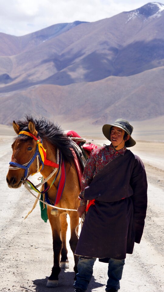 Mountains horse people people