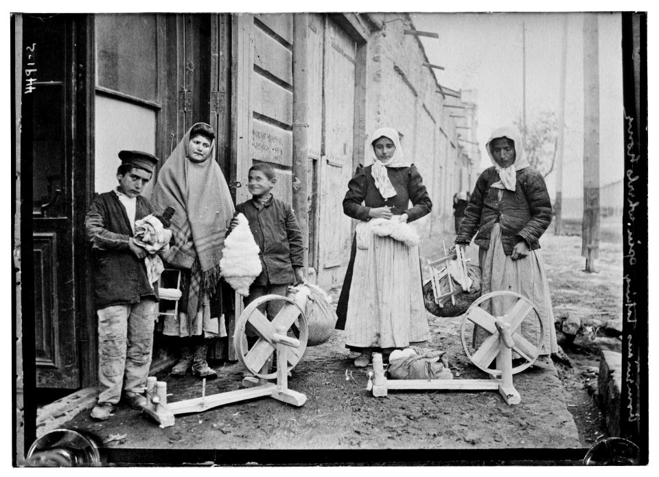 Armenians taking spin.(i.e. spinning) wheels home LCCN2014706357