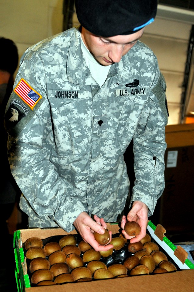 Army specialist assigned to the Naval Station Guantanamo inspects food that is distributed to base residents DVIDS357986