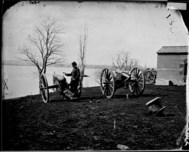 Artillery soldier with cannon - NARA - 529170 photo