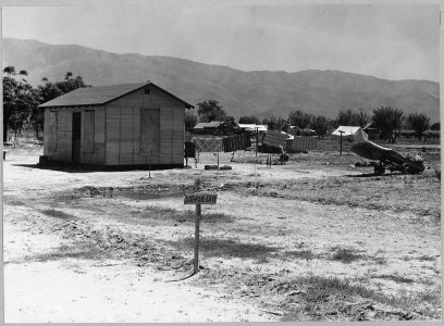 Arvin, Kern County, California. A newly-built house in one of four rapidly growing shacktown communi . . . - NARA - 521649 photo