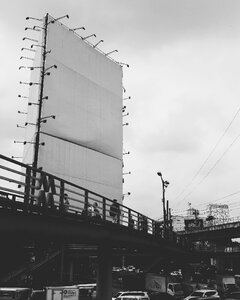 Blank billboard footbridge black and white photo