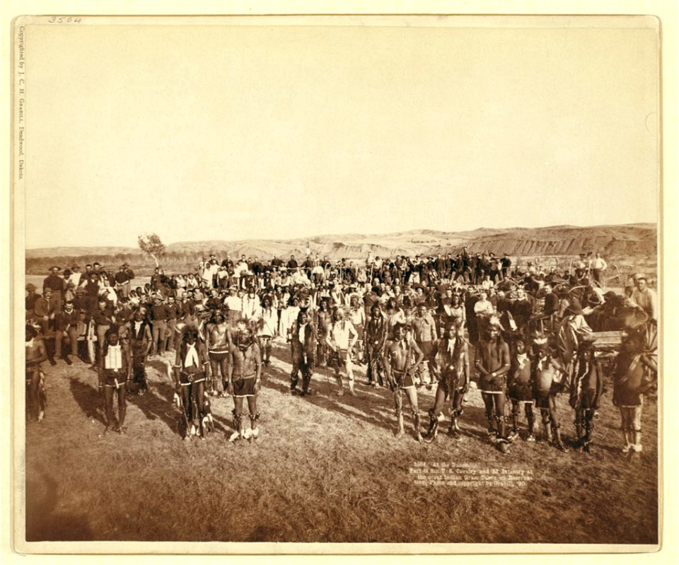 At the Dance. Part of the 8th U.S. Cavalry and 3rd Infantry at the great Indian Grass Dance on Reservation LCCN99613793