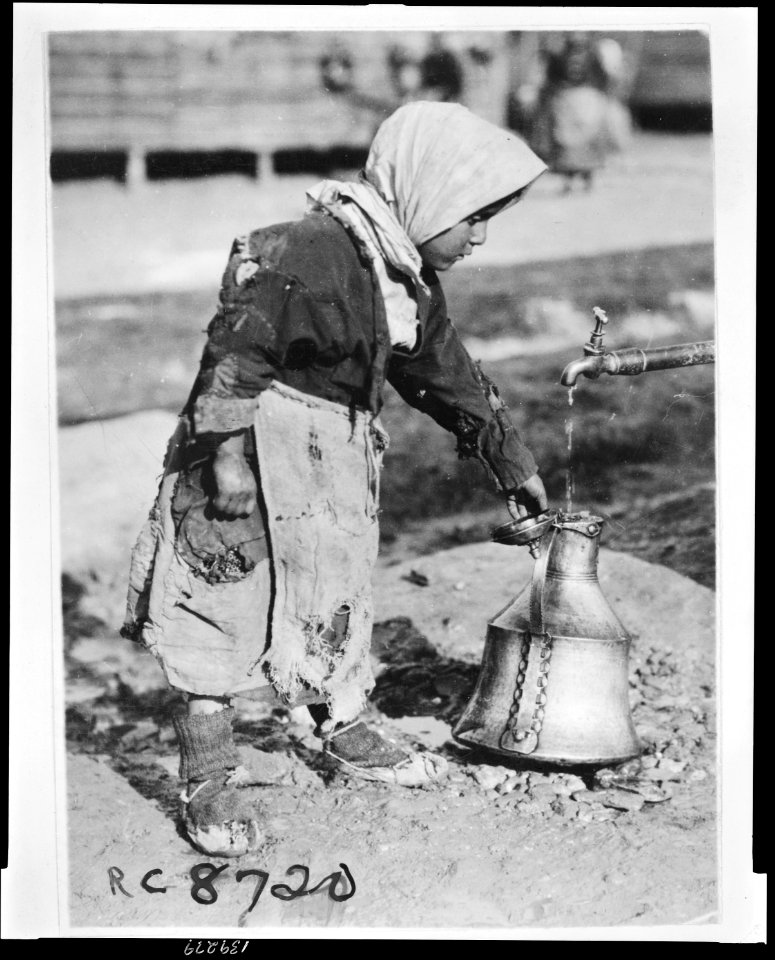 At the well A young ragged member of the colony of Greeks who have reached Salonica from the Caucasus for the purpose of settling again in their native land. The water supply at the camp was LCCN2010648478