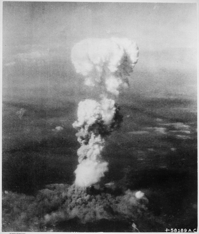 At the time this photo was made, smoke billowed 20,000 feet above Hiroshima while smoke from the burst of the first atom - NARA - 542192