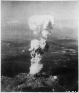 At the time this photo was made, smoke billowed 20,000 feet above Hiroshima while smoke from the burst of the first atom - NARA - 542192