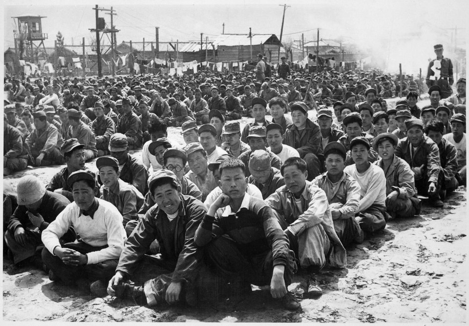 At the United Nations' prisoner-of-war camp at Pusan, prisoners are assembled in one of the camp compounds. The camp... - NARA - 541956