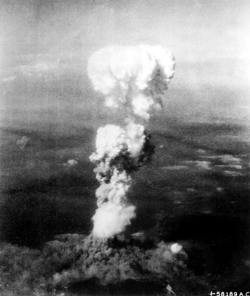 At the time this photo was made, smoke billowed 20,000 feet above Hiroshima while smoke from the burst of the first atom - NARA - 542192