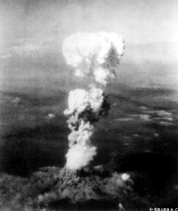 At the time this photo was made, smoke billowed 20,000 feet above Hiroshima while smoke from the burst of the first atom - NARA - 542192