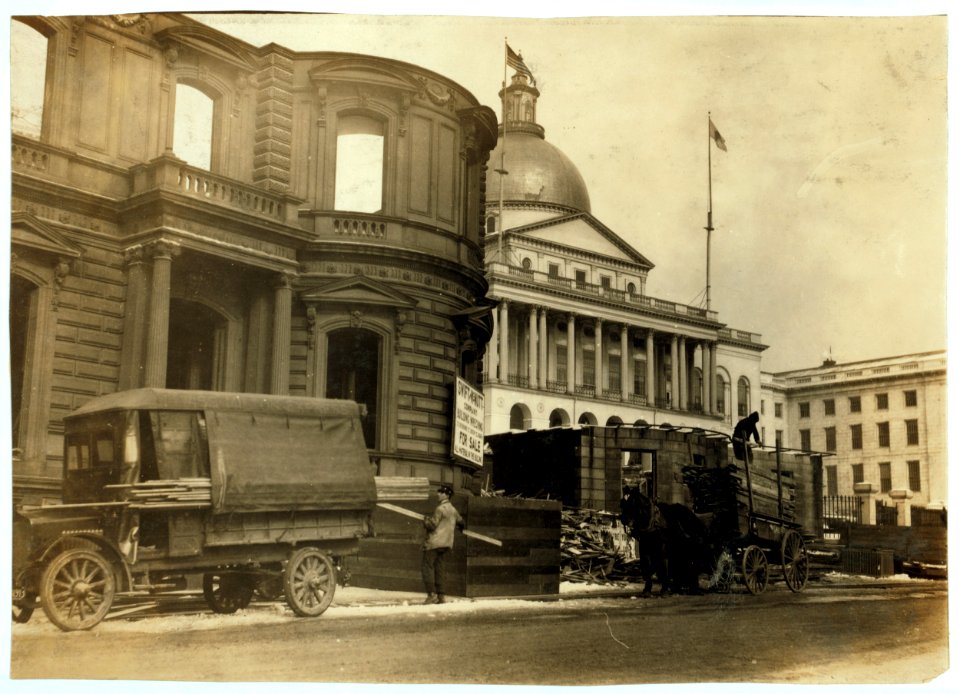 Beacon Street residence being demolished (next to State House) Young children carry the wood home. LOC nclc.05157