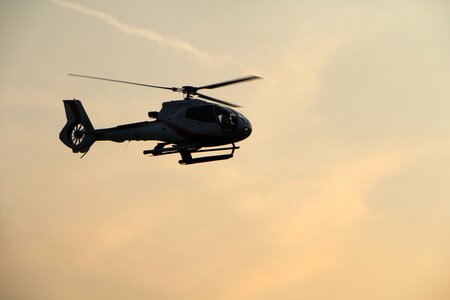 Helicopter sky sun