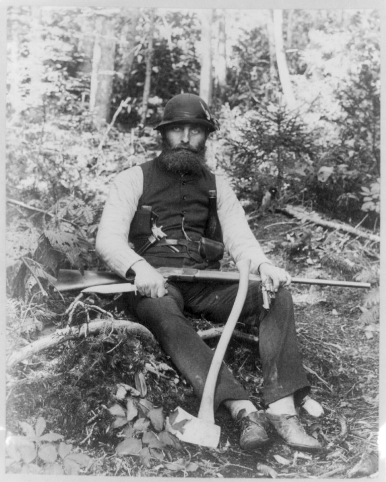 Bearded man armed with ax, rifle, hunting knife, and two pistols, Maine LCCN2002711534