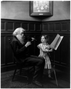 Bearded man playing violin and girl turning pages of music LCCN2002699158