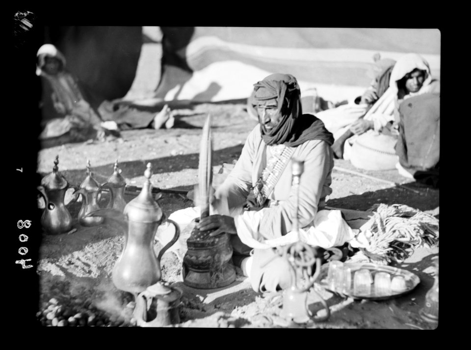 Bedouin life in Trans-Jordan. Pounding coffee to a rhythmic tune LOC matpc.15661