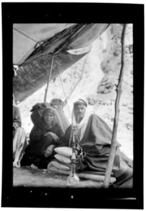 Bedouin life in Trans-Jordan. Semi Bedouin types of Es Salt. Young man and mother at hot springs of Zerka Ma'in LOC matpc.15669