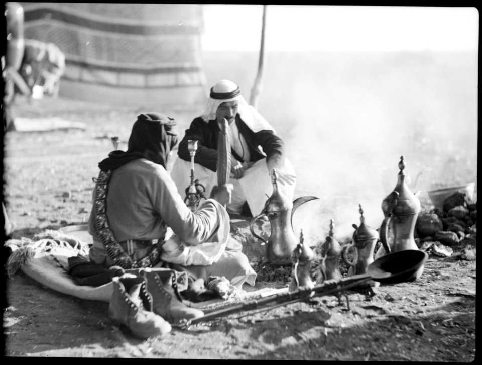 Bedouin life in Trans-Jordan. An array of coffee pots around the fire LOC matpc.15662