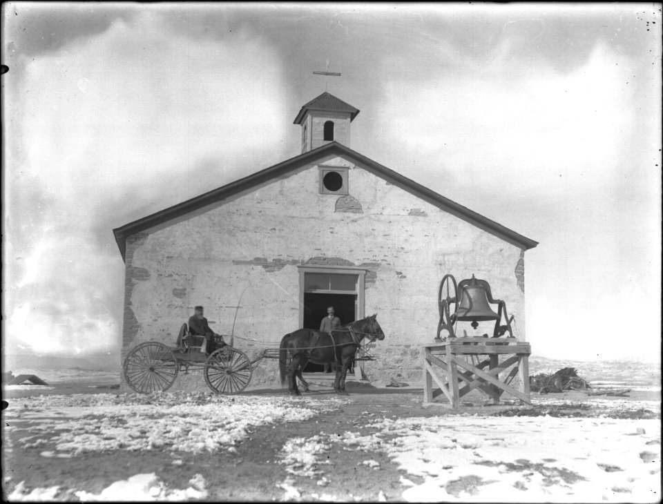 Bell and horse-drawn wagon in front of a mission, Arizona or New Mexico, ca.1903 (CHS-4992)