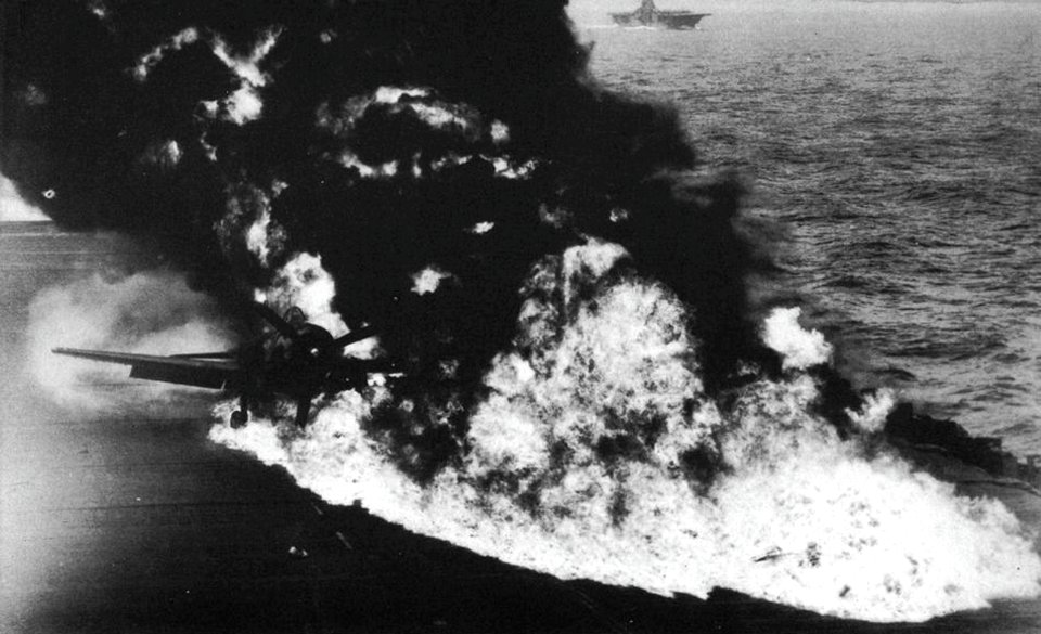 Belly tank of a Grumman F6F-5 Hellcat bursts into flames aboard USS Randolph (CV-15), in 1945