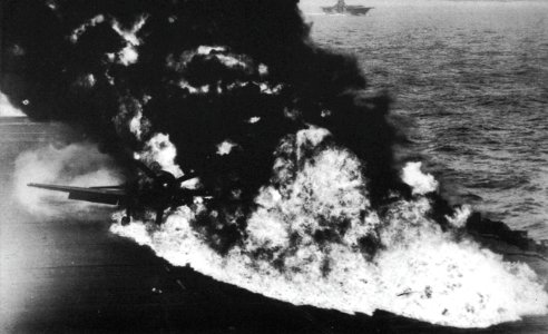Belly tank of a Grumman F6F-5 Hellcat bursts into flames aboard USS Randolph (CV-15), in 1945