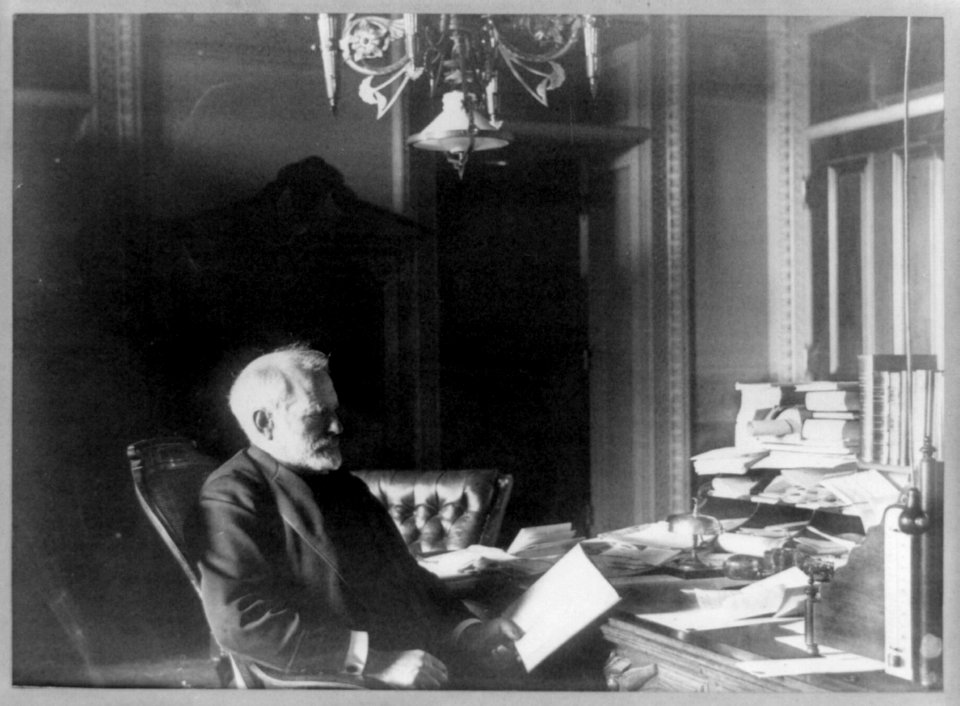 Benjamin Franklin Tracy, Secretary of the Navy, half-length portrait, seated at desk, facing left, looking at paper) - Miss Johnston, no. 1332 V Street LCCN89709674